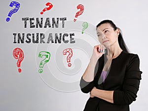 Business concept meaning TENANT INSURANCE question marks with phrase on the gray wall