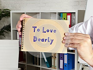 Business concept meaning To Love Dearly with phrase on the sheet photo