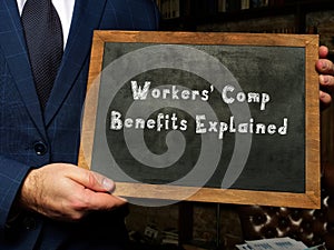 Business concept meaning Workers` Comp Benefits Explained with inscription on chalkboard