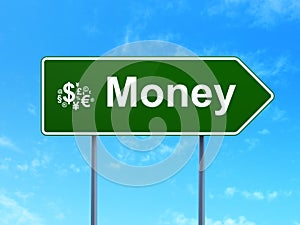 Business concept: Money and Finance Symbol on road sign background