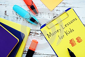 Business concept about Money Lessons For Kids with sign on the sheet