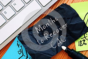 Business concept about Months to Recover CAC with phrase on the piece of paper