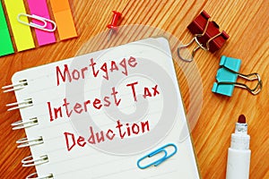 Business concept about Mortgage Interest Tax Deduction with sign on the sheet