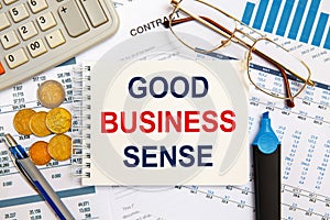 Business concept - notebook writing GOOD BUSINESS SENSE