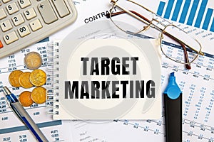 Business concept - notebook writing TARGET MARKETING