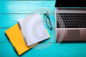 Business concept. Online education. Workplace with computer and notebooks with copy space. Top view. Mock up photo