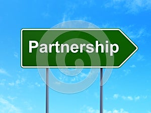 Business concept: Partnership on road sign background