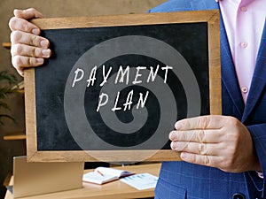 Business concept about PAYMENT PLAN with phrase on the blackboard