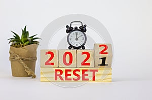 Business concept of planning 2022 reset symbol. Turned a wooden cube and changed words `Reset 2021` to `Reset 2022`. Beautiful