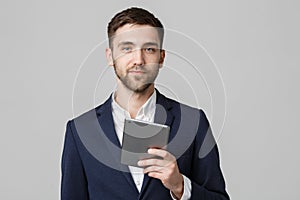 Business Concept - Portrait Handsome Business man playing digital tablet with smiling confident face. White Background. Copy Space