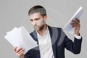 Business Concept - Portrait Handsome Business man serious working with annual report. isolated White Background. Copy space.