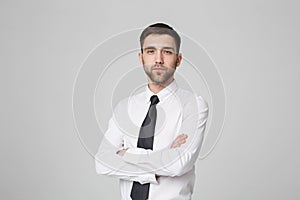 Business Concept - Portrait Handsome Business man crossing arms with confident face. White Background. Copy Space.