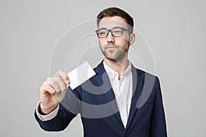 Business Concept - Portrait Handsome Business man showing name card with smiling confident face. White Background.Copy