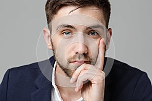 Business Concept - Portrait handsome handsome business man in suit smiling and siting in work office with serious and