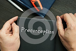 Business concept about Preconception with phrase on the piece of paper