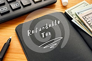 Business concept about Refundable Tax with inscription on the sheet