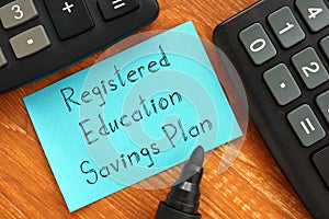 Business concept about Registered Education Savings Plan RESP with sign on the page