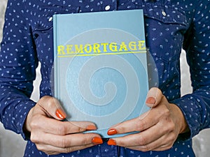Business concept about REMORTGAGE with sign on the piece of paper