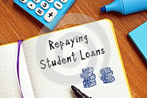 Business concept about Repaying Your Student Loans with phrase on the page photo
