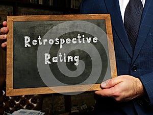 Business concept about Retrospective Rating with inscription on the black chalkboard photo