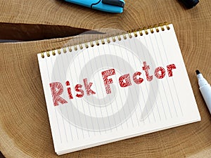 Business concept about Risk Factor with phrase on the sheet