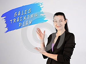 Business concept about SALES TRAINING PLAN with phrase on the wall