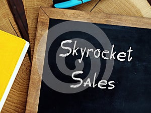 Business concept about Skyrocket Sales with sign on the sheet