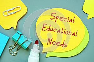 Business concept about Special Educational Needs with sign on the piece of paper