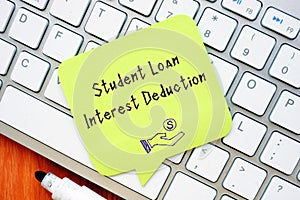 Business concept about Student Loan Interest Deduction with inscription on the page
