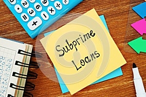 Business concept about Subprime Loans with sign on the sheet