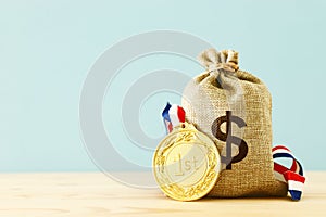 Business Concept of Success, Best Investment and reward for Performance. Money Bag with Gold Medal