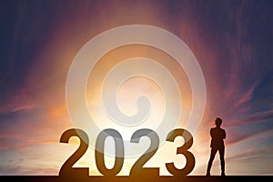 Business Concept for success in the future goal.Business man stand with 2023