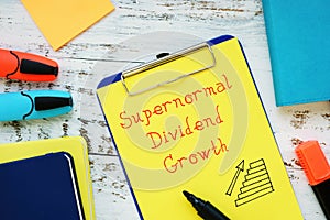 Business concept about Supernormal Dividend Growth with phrase on the piece of paper