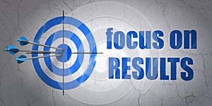 Business concept: target and Focus on RESULTS on wall background