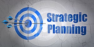 Business concept: target and Strategic Planning on wall background