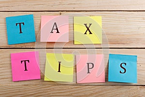 Business concept for taxpayer - Many colorful sticky note with text Tax tips