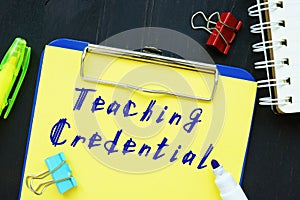 Business concept about Teaching Credential with phrase on the sheet