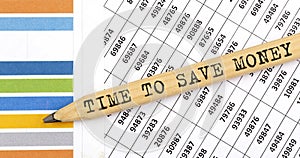 Business concept TIME TO SAVE MONEY text on the pencil on chart background