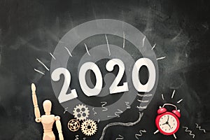 Business concept, top view of blackboard with the phrase 2020