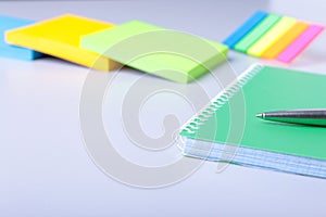 Business concept. Top view of kraft spiral notebook, glasses and pen isolated on background for mockup.