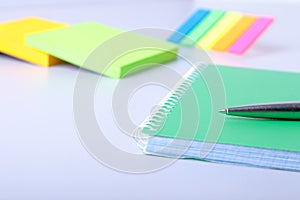 Business concept. Top view of kraft spiral notebook, glasses and pen isolated on background for mockup.