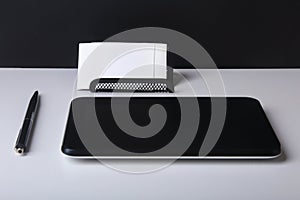 Business concept. Top view of kraft spiral notebook, glasses, smartphone and black pen on background for mockup.