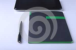 Business concept. Top view of kraft spiral notebook, glasses, smartphone and black pen on background for mockup.