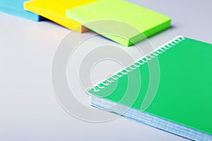 Business concept. Top view of kraft spiral notebook, glasses, smartphone and black pen isolated on background for mockup