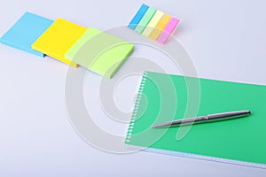 Business concept. Top view of kraft spiral notebook, glasses, smartphone and black pen isolated on background for mockup