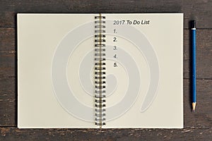 Business concept - Top view notebook writing 2017 To Do List, pe