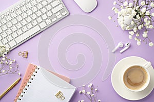 Business concept. Top view photo of keyboard computer mouse cup of coffee saucer planners gold pen binder clips earbuds vase with