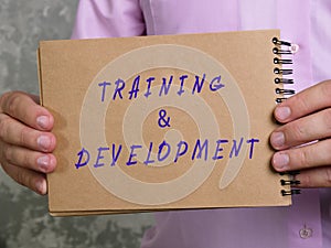 Business concept about TRAINING & DEVELOPMENT with inscription on the page