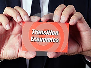 Business concept about Transition Economies with sign on the sheet
