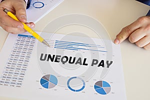 Business concept about UNEQUAL PAY with sign on the chart sheet